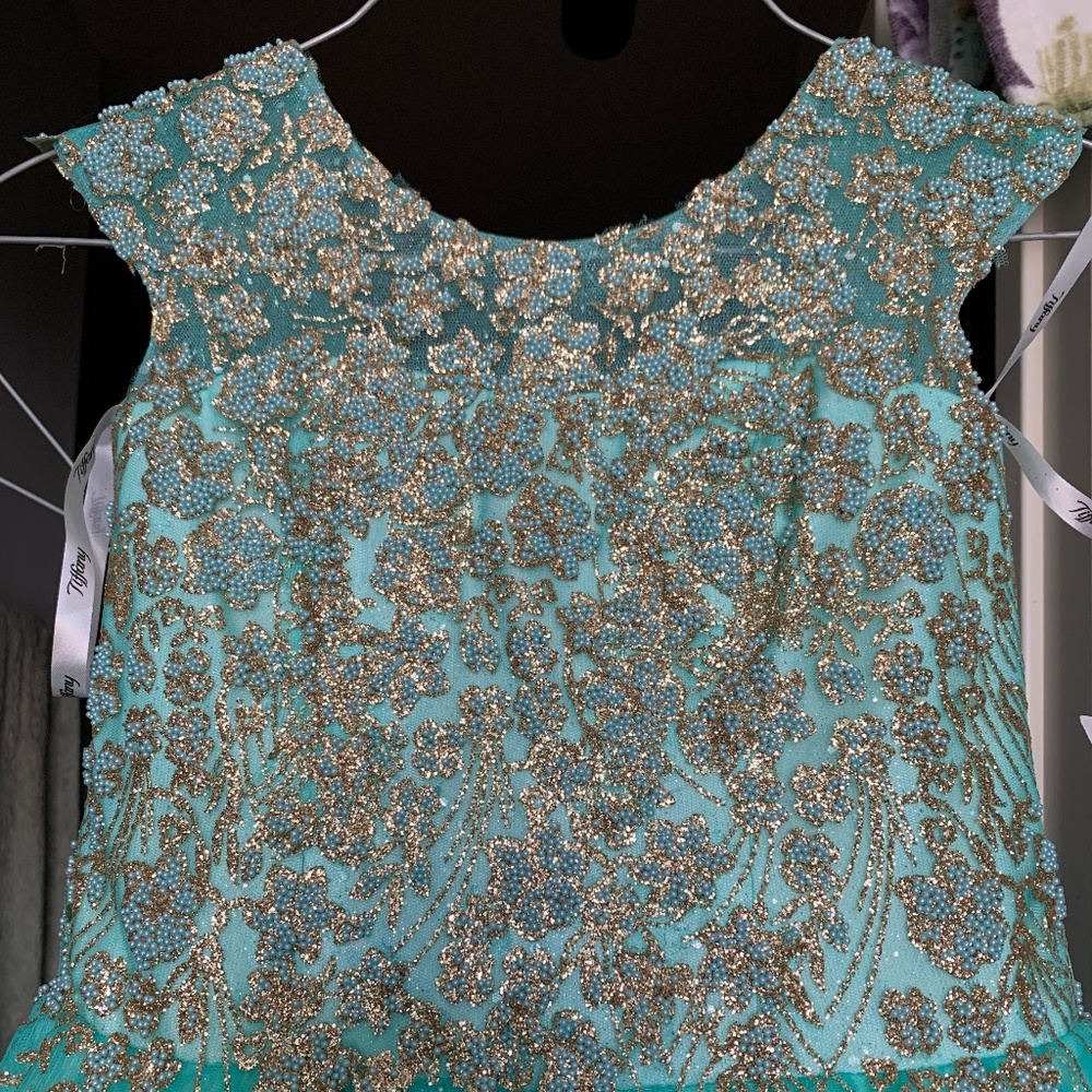 Sold Brand new with tags Aqua Tiffany size 4